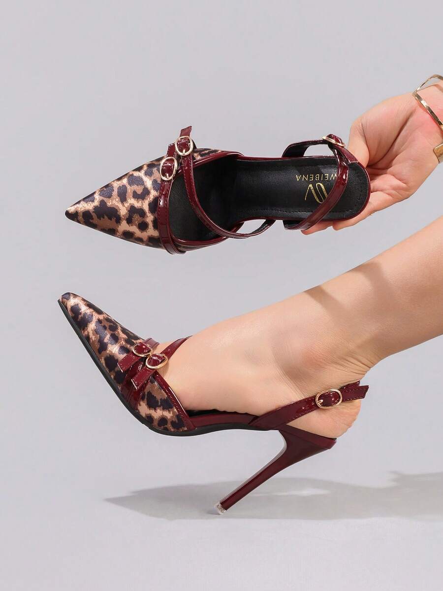 Black lace pointed toe high heel pumps featuring stiletto heels and a decorative bow accent.