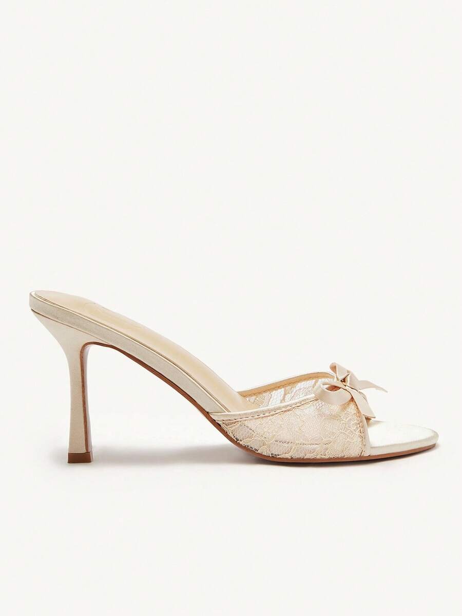 Elegant women's pointed toe high heel mules crafted from smooth PU leather with stiletto heels and delicate bow detail.