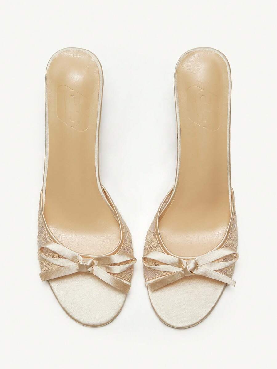 Elegant women's pointed toe high heel mules crafted from smooth PU leather with stiletto heels and delicate bow detail.