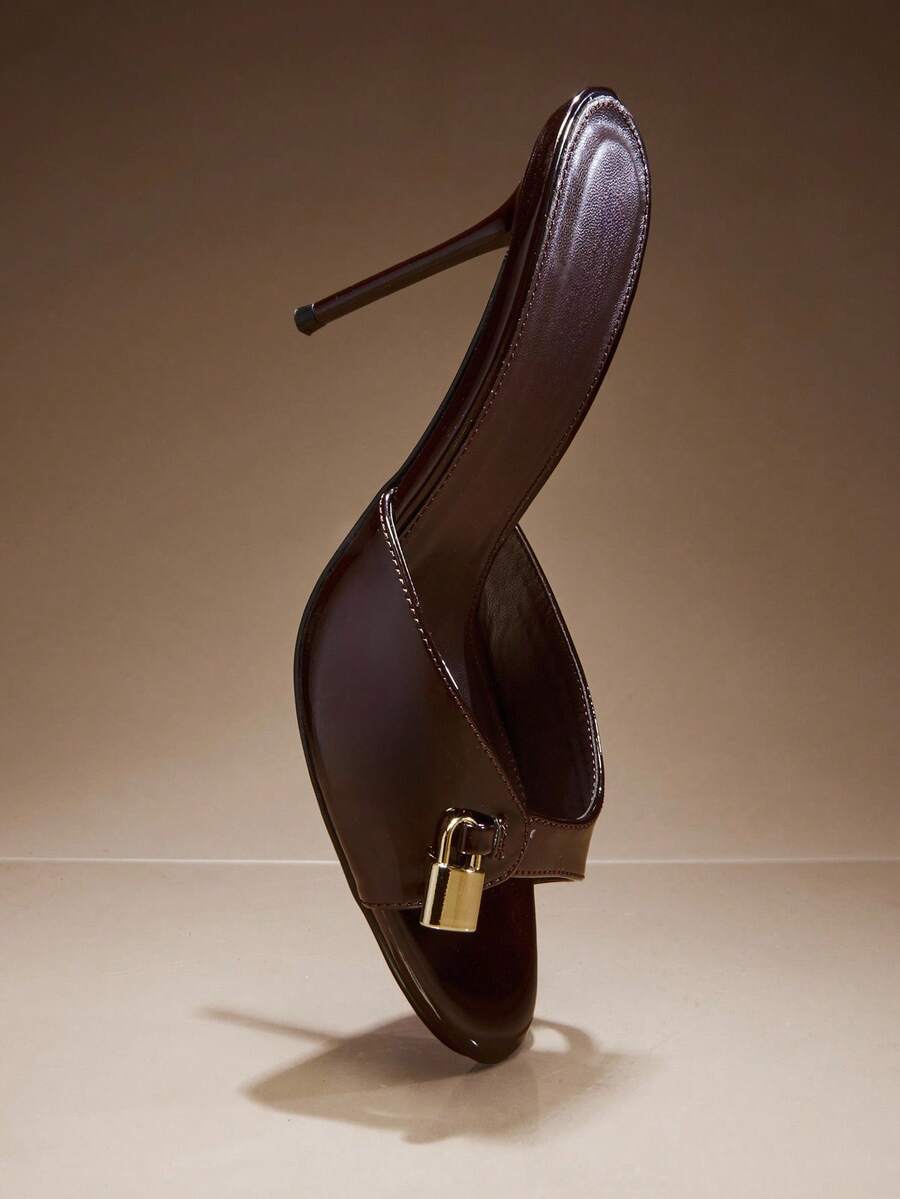 Women's slip-on heeled sandals with metal-coated stiletto heels and lock decoration in chocolate brown PU leather.