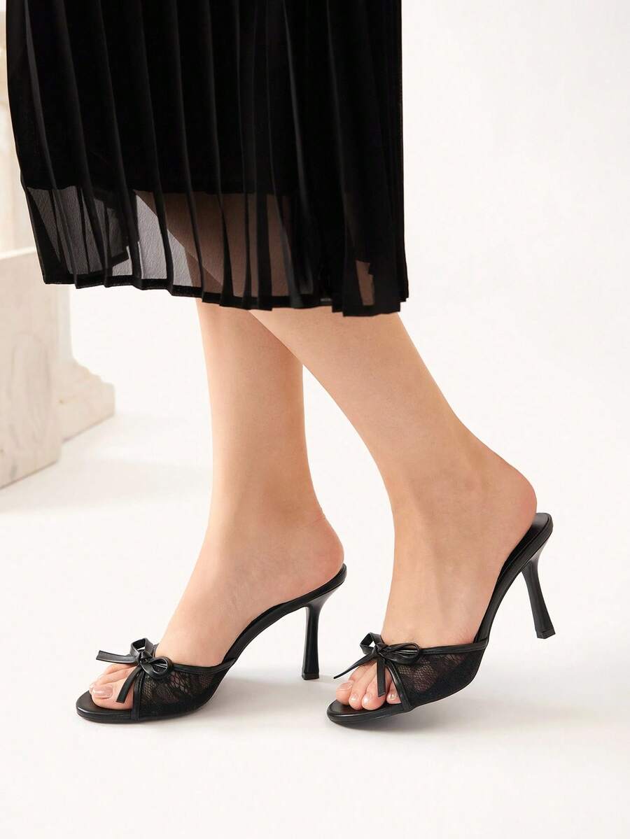 Elegant women's pointed toe high heel mules crafted from smooth PU leather with stiletto heels and delicate bow detail.