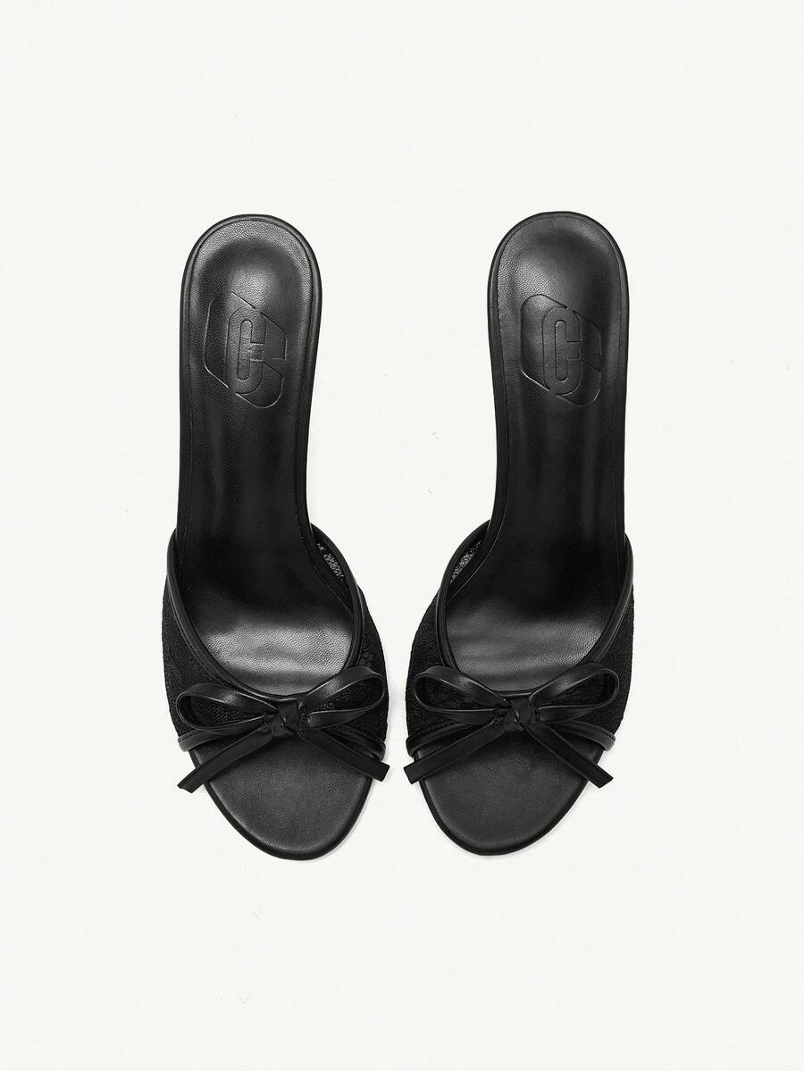 Elegant women's pointed toe high heel mules crafted from smooth PU leather with stiletto heels and delicate bow detail.