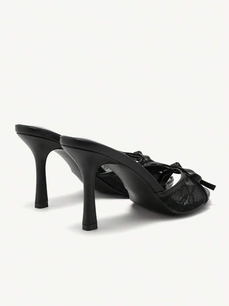 Elegant women's pointed toe high heel mules crafted from smooth PU leather with stiletto heels and delicate bow detail.