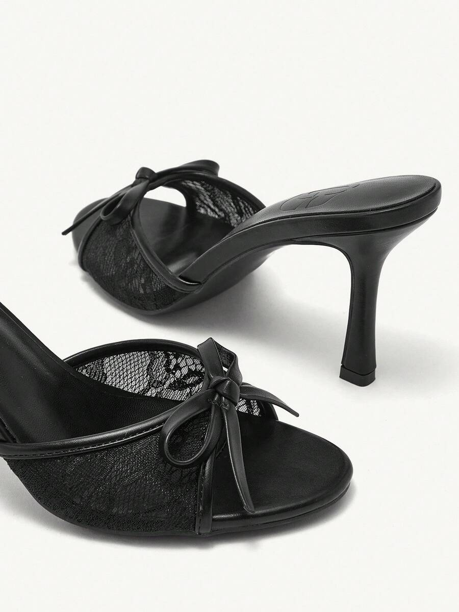 Elegant women's pointed toe high heel mules crafted from smooth PU leather with stiletto heels and delicate bow detail.