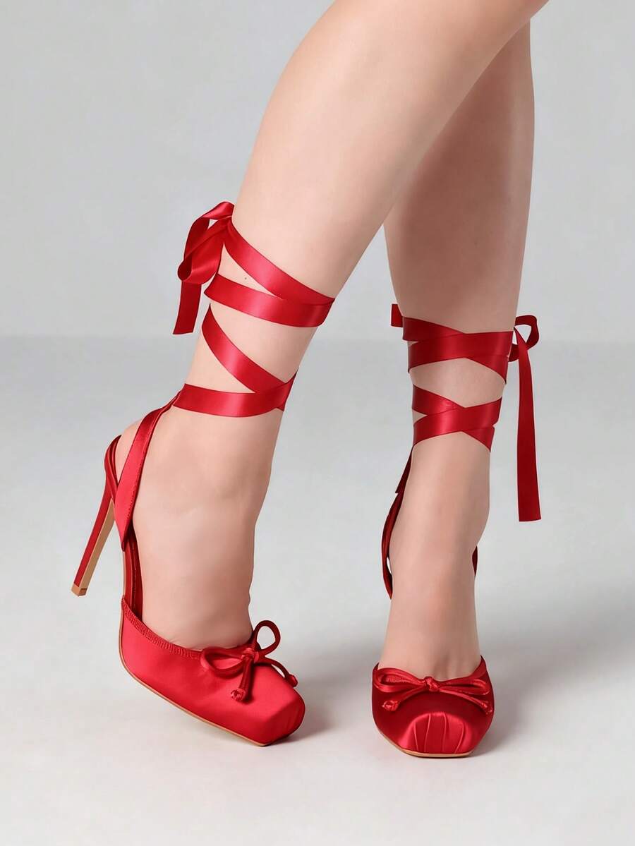 Women's square toe satin ballet stiletto heels with lace-up straps and bow detail.