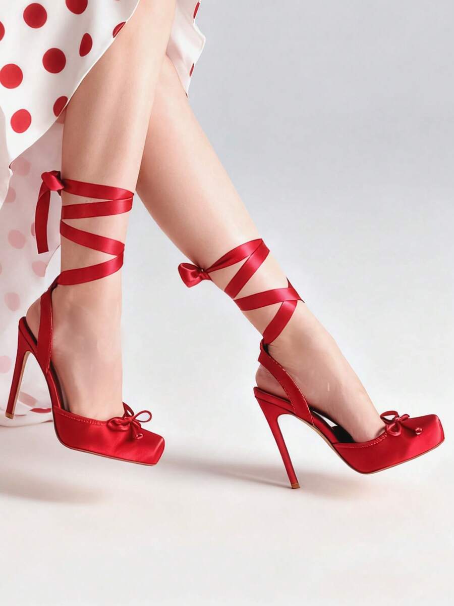 Women's square toe satin ballet stiletto heels with lace-up straps and bow detail.