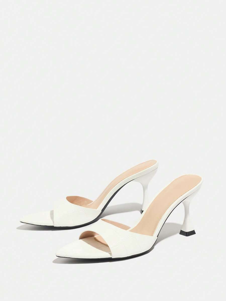 Women's pointed toe high heel mule sandals featuring a sleek slip-on design with elegant lace embroidery detailing