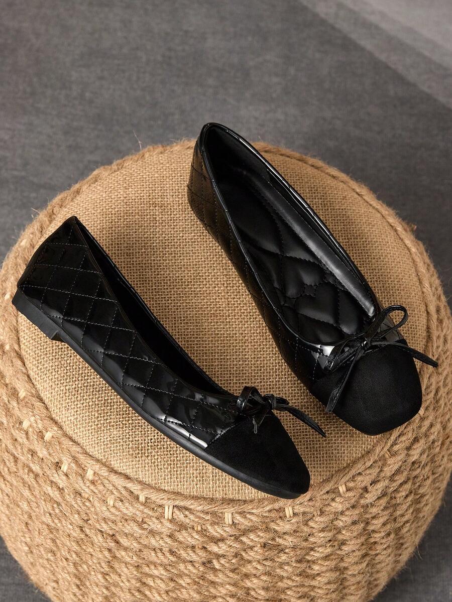 Pair of women's square toe slip-on flat shoes featuring a delicate bow detail and low vamp design.