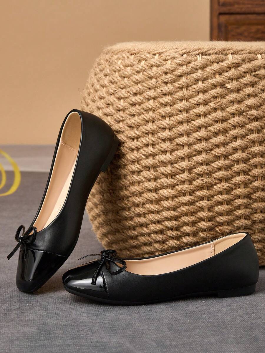 Pair of women's square toe slip-on flat shoes featuring a delicate bow detail and low vamp design.