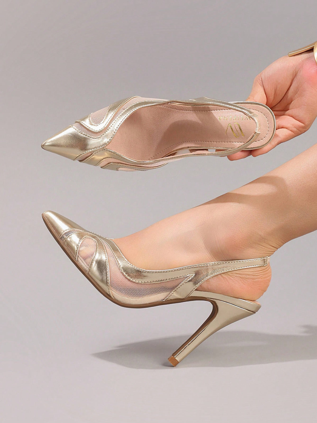 Black lace pointed toe high heel pumps featuring stiletto heels and a decorative bow accent.
