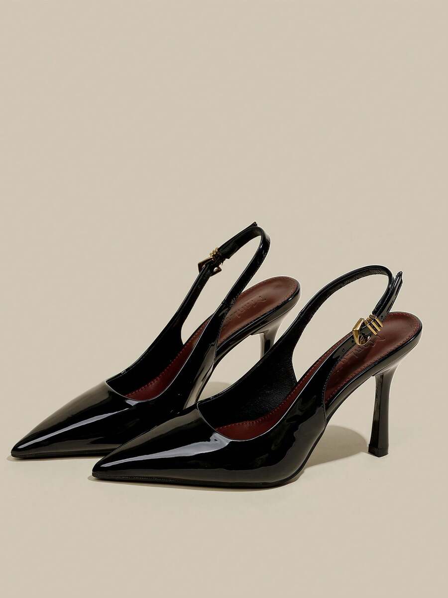 Women's pointed toe kitten heel pumps with adjustable buckle back strap and sleek patent finish.
