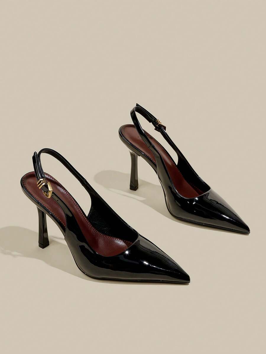 Women's pointed toe kitten heel pumps with adjustable buckle back strap and sleek patent finish.