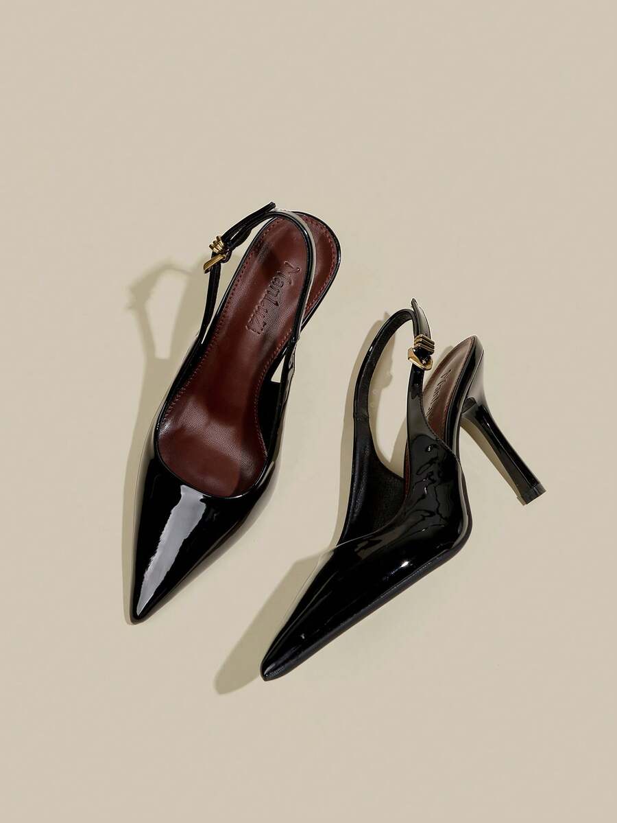 Women's pointed toe kitten heel pumps with adjustable buckle back strap and sleek patent finish.