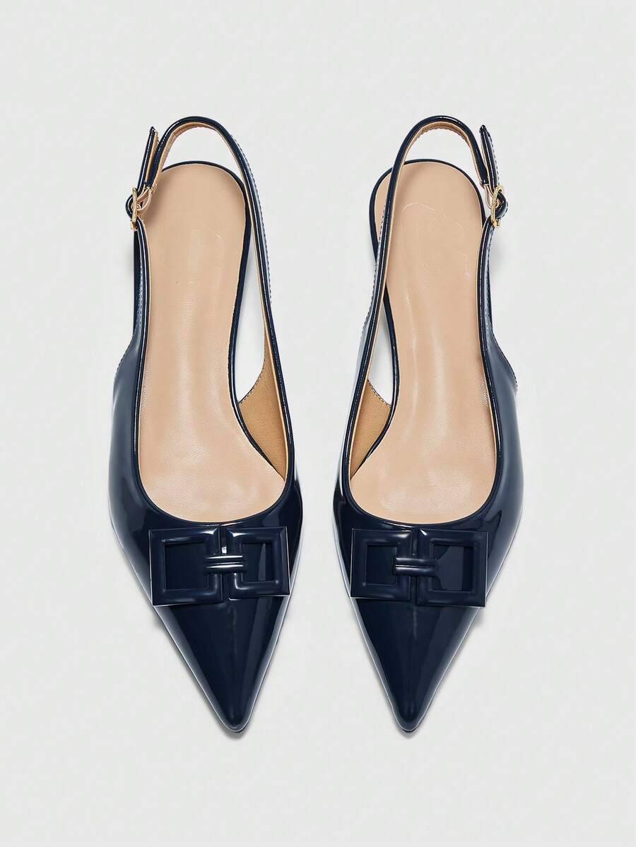Women's pointed toe low wedge flat shoes crafted in PU leather with a slingback strap and stylish metal buckle detail.
