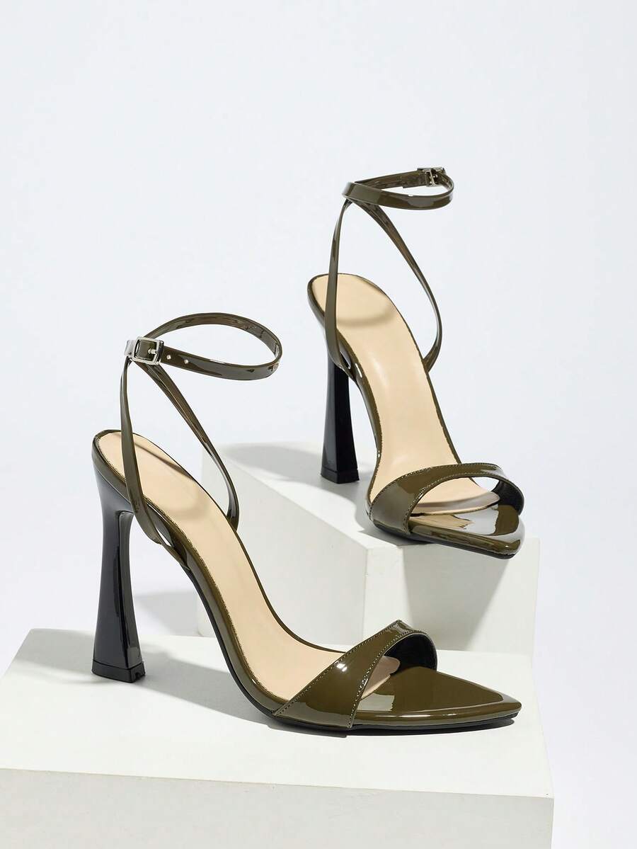 Burgundy open-toe high heels featuring an adjustable ankle strap with buckle closure and high stiletto heel.