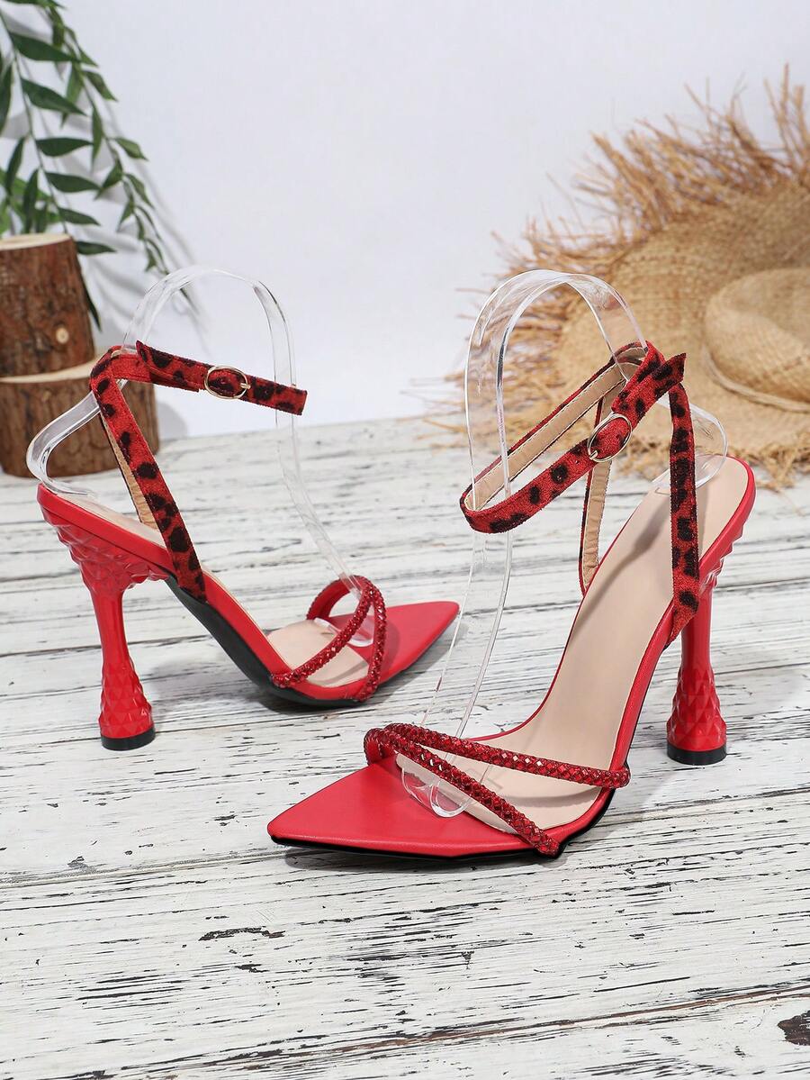 Women's peep toe stiletto high heel strappy sandals with rhinestone accents and slip-on design.