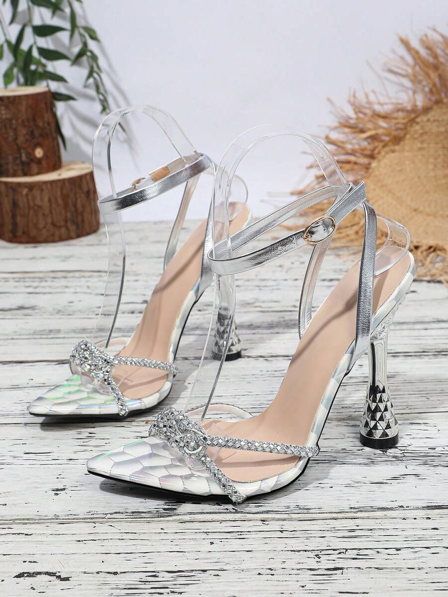 Women's peep toe stiletto high heel strappy sandals with rhinestone accents and slip-on design.