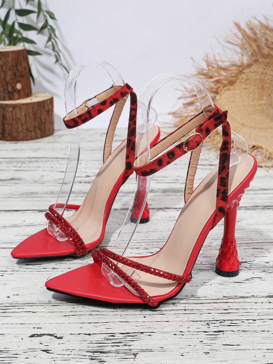 Women's peep toe stiletto high heel strappy sandals with rhinestone accents and slip-on design.