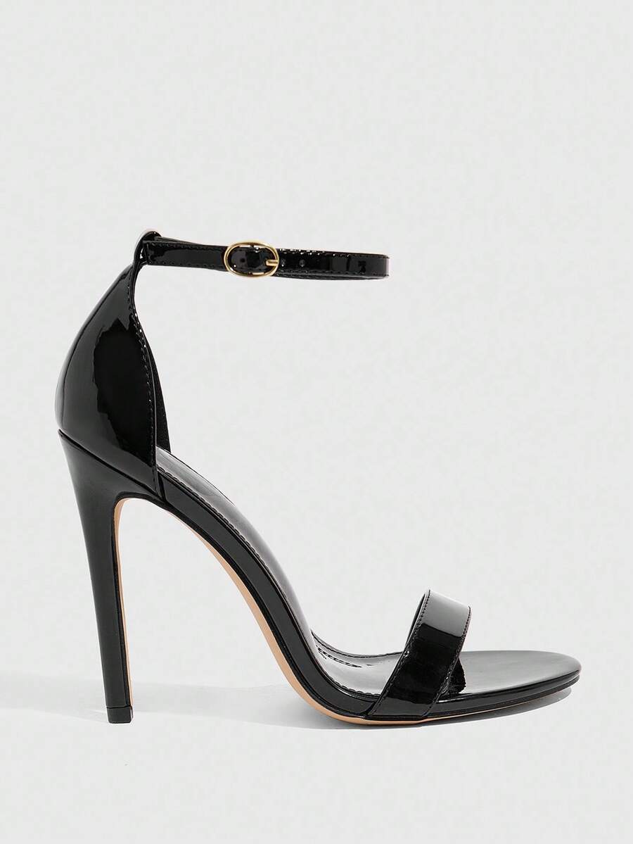 Women's stiletto sandals featuring an ankle strap buckle closure and classic round open toe design.