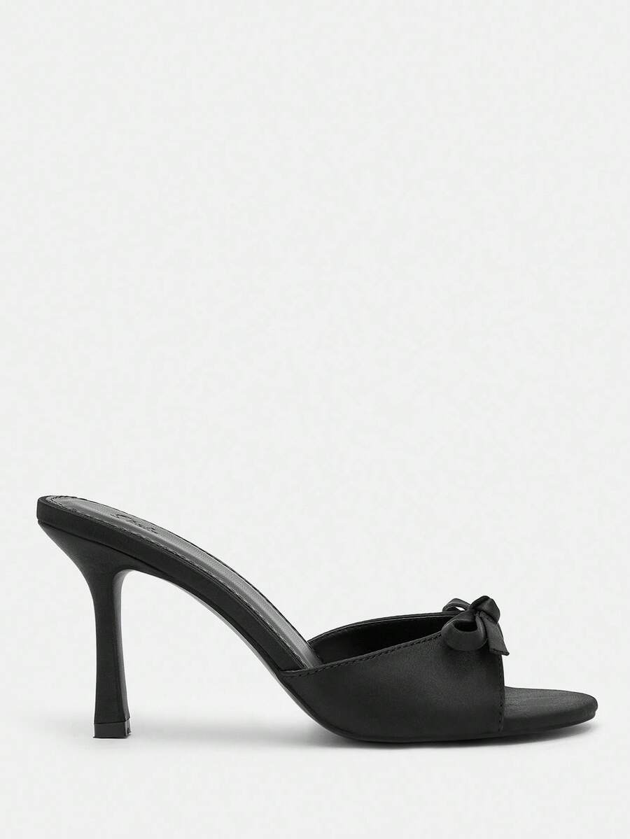 Pair of women's open toe stiletto heeled sandals crafted in satin with a bow accent