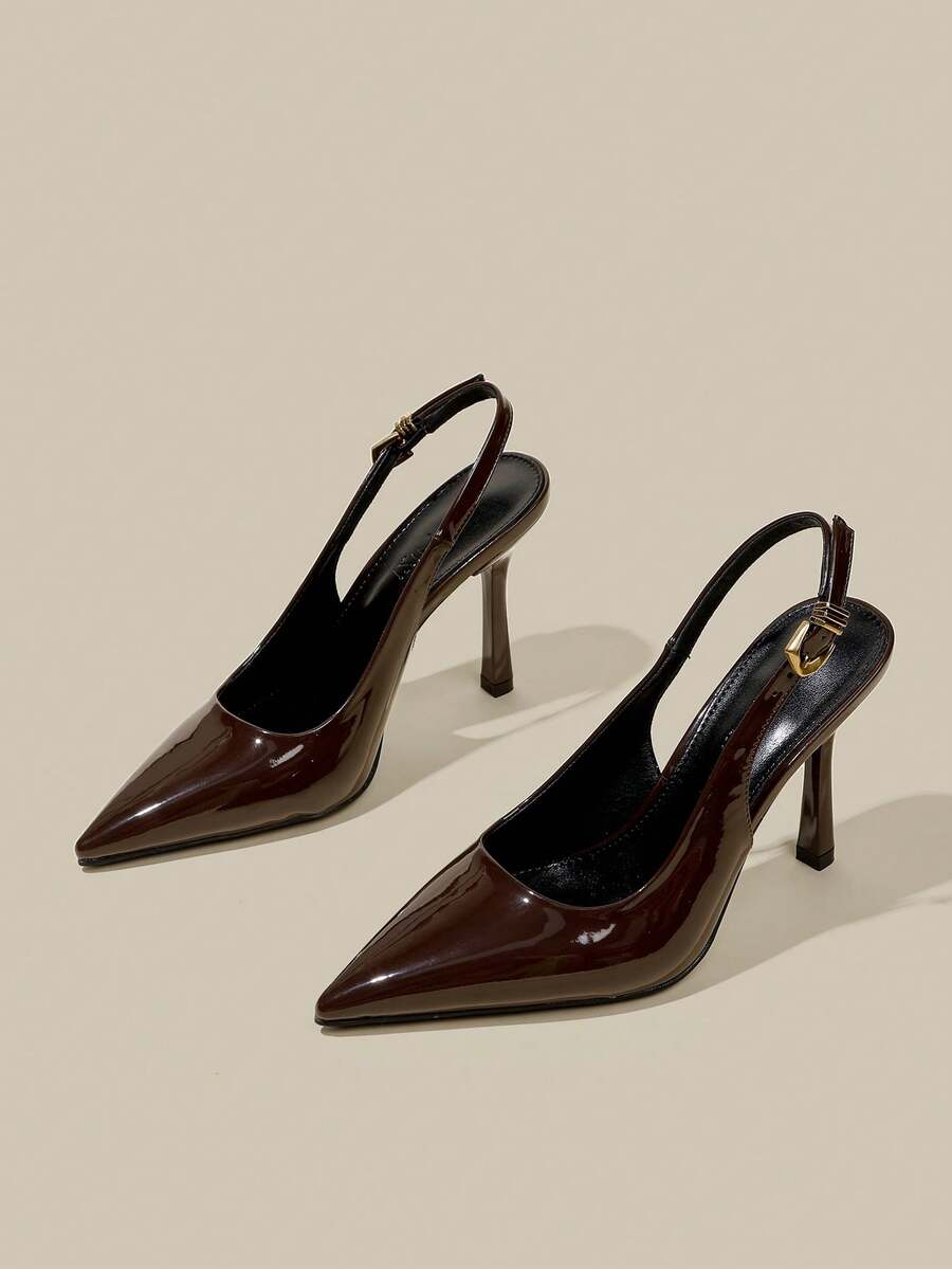 Women's pointed toe kitten heel pumps with adjustable buckle back strap and sleek patent finish.