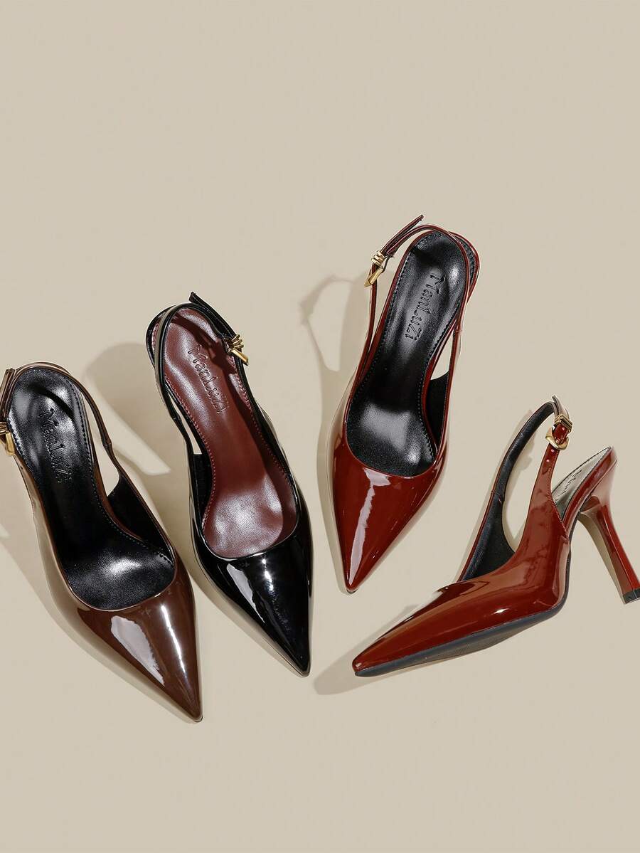 Women's pointed toe kitten heel pumps with adjustable buckle back strap and sleek patent finish.