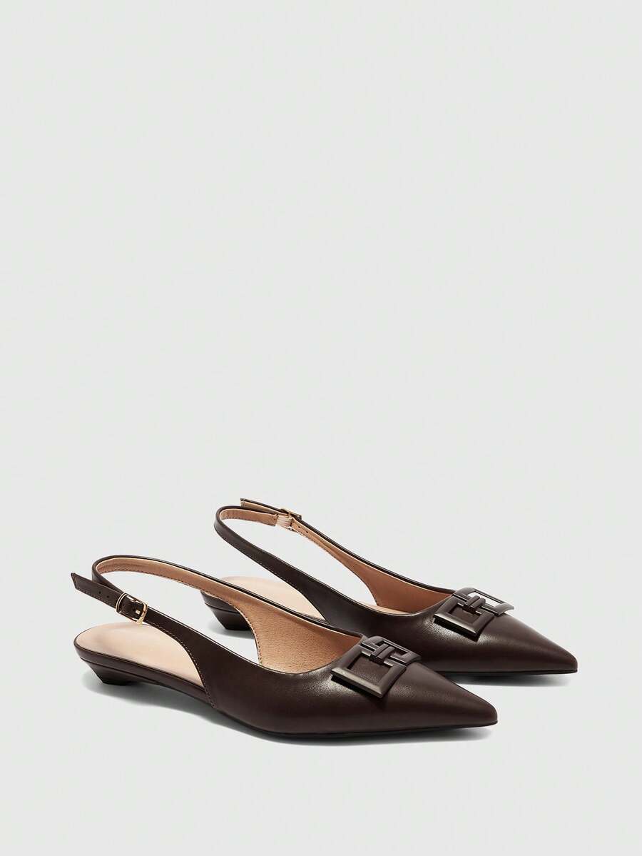 Women's pointed toe low wedge flat shoes crafted in PU leather with a slingback strap and stylish metal buckle detail.