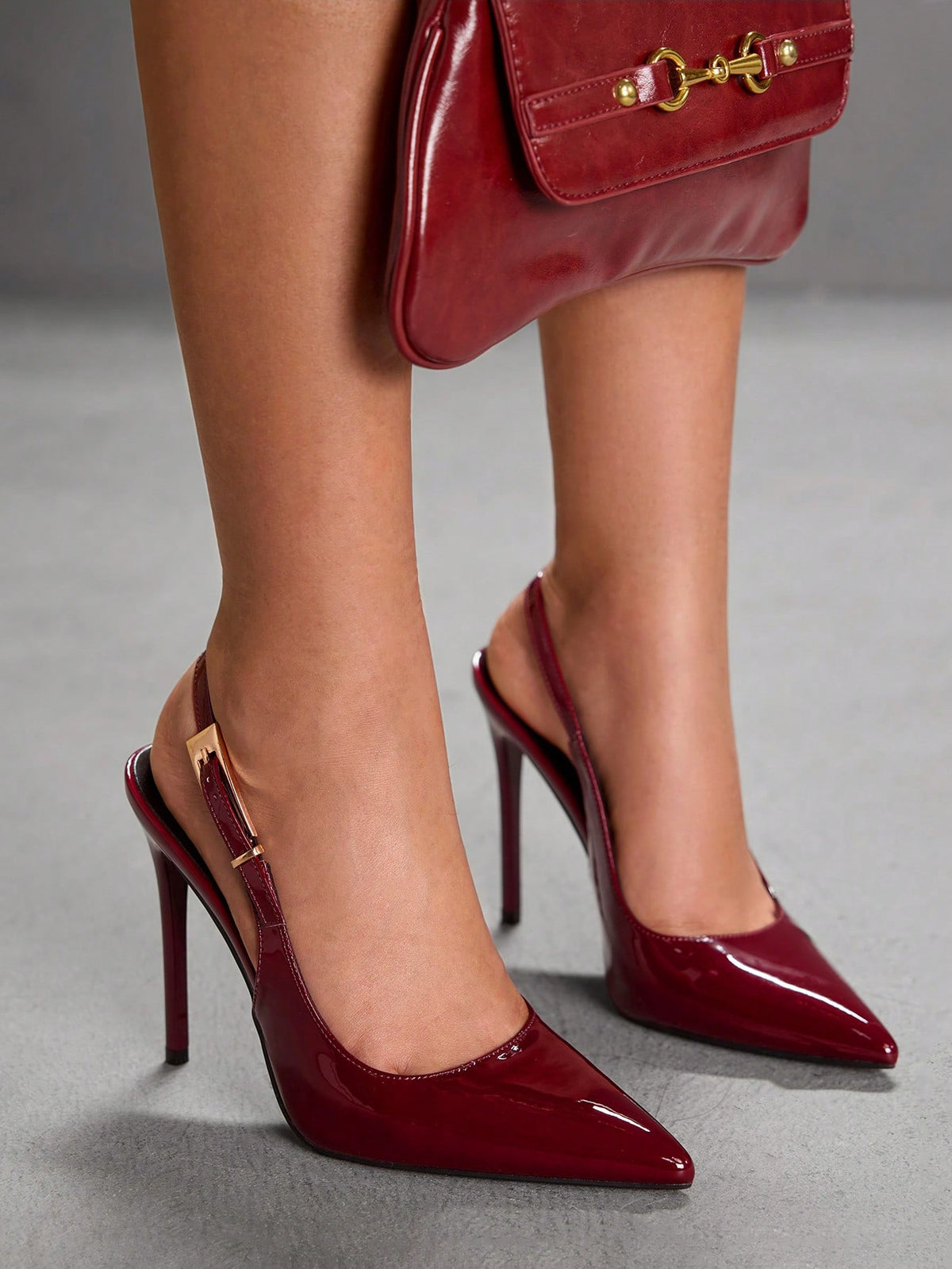 Pointed toe stiletto high heel evening party pumps featuring an ankle strap with buckle closure.