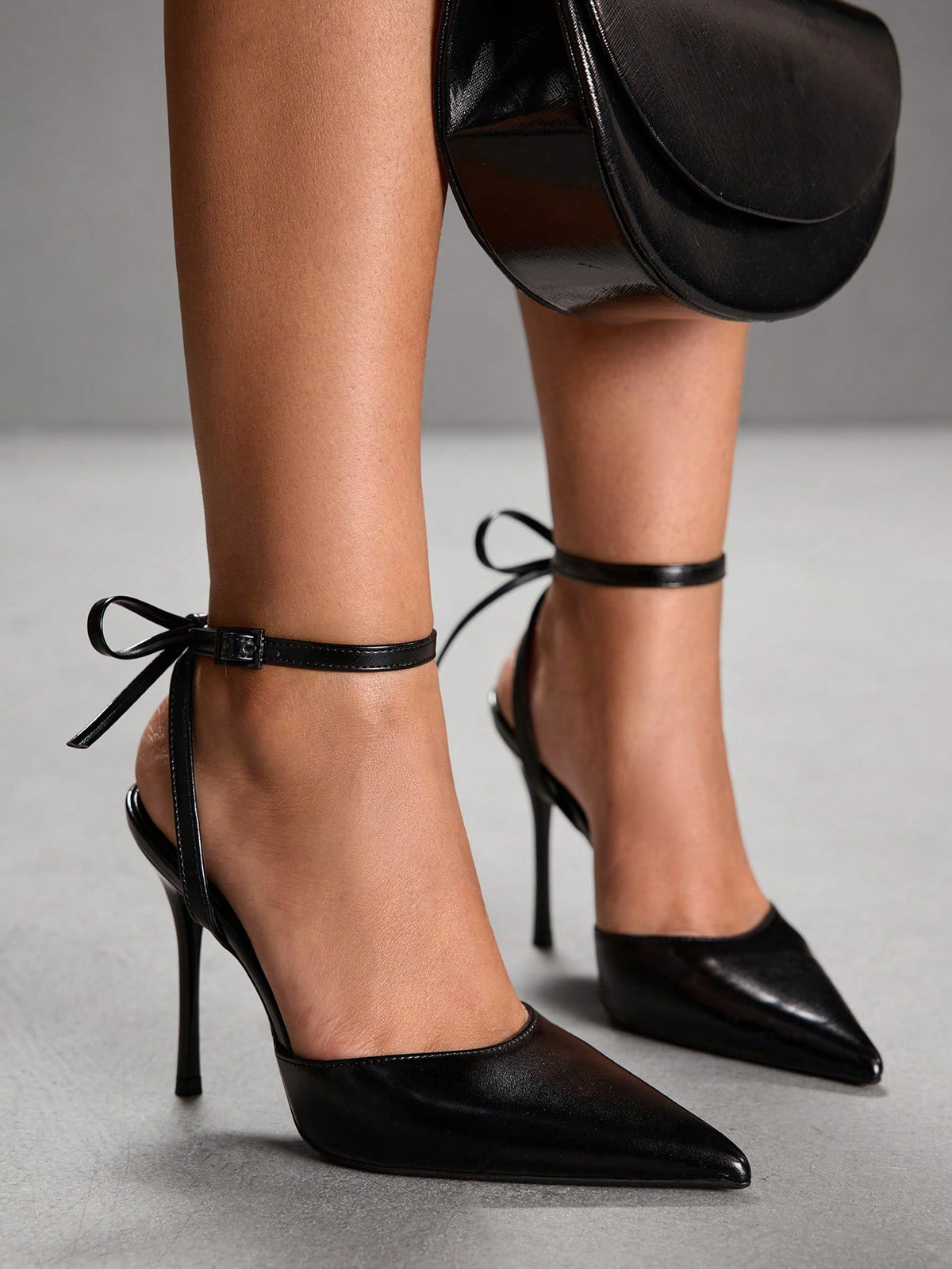 Women's pointed toe ankle strap stiletto high heel pumps featuring smooth PU leather and delicate buckle closure