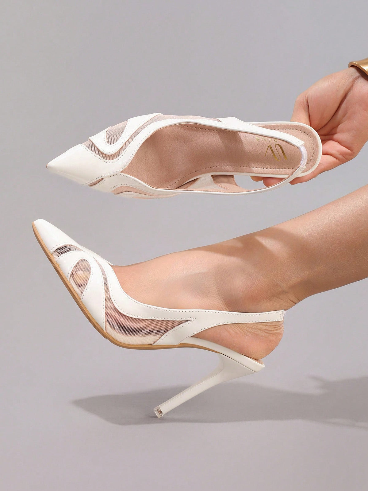 Black lace pointed toe high heel pumps featuring stiletto heels and a decorative bow accent.