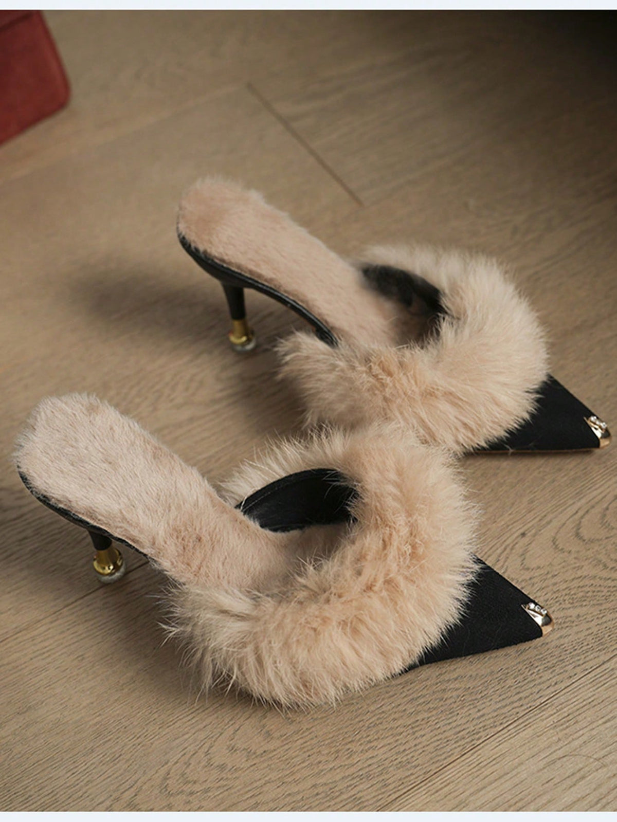 Burgundy pointed toe stiletto heel mules featuring fuzzy faux fur trim and a sleek slip-on design.
