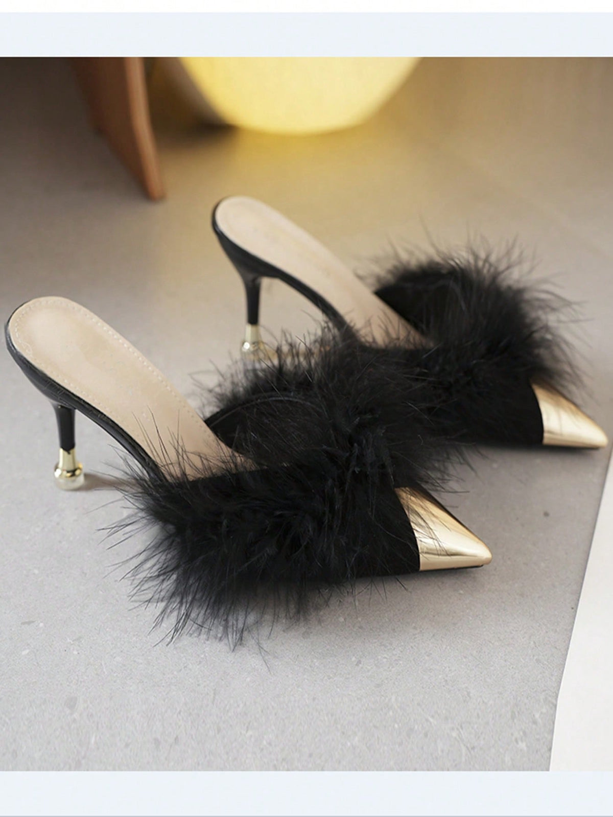 Burgundy pointed toe stiletto heel mules featuring fuzzy faux fur trim and a sleek slip-on design.