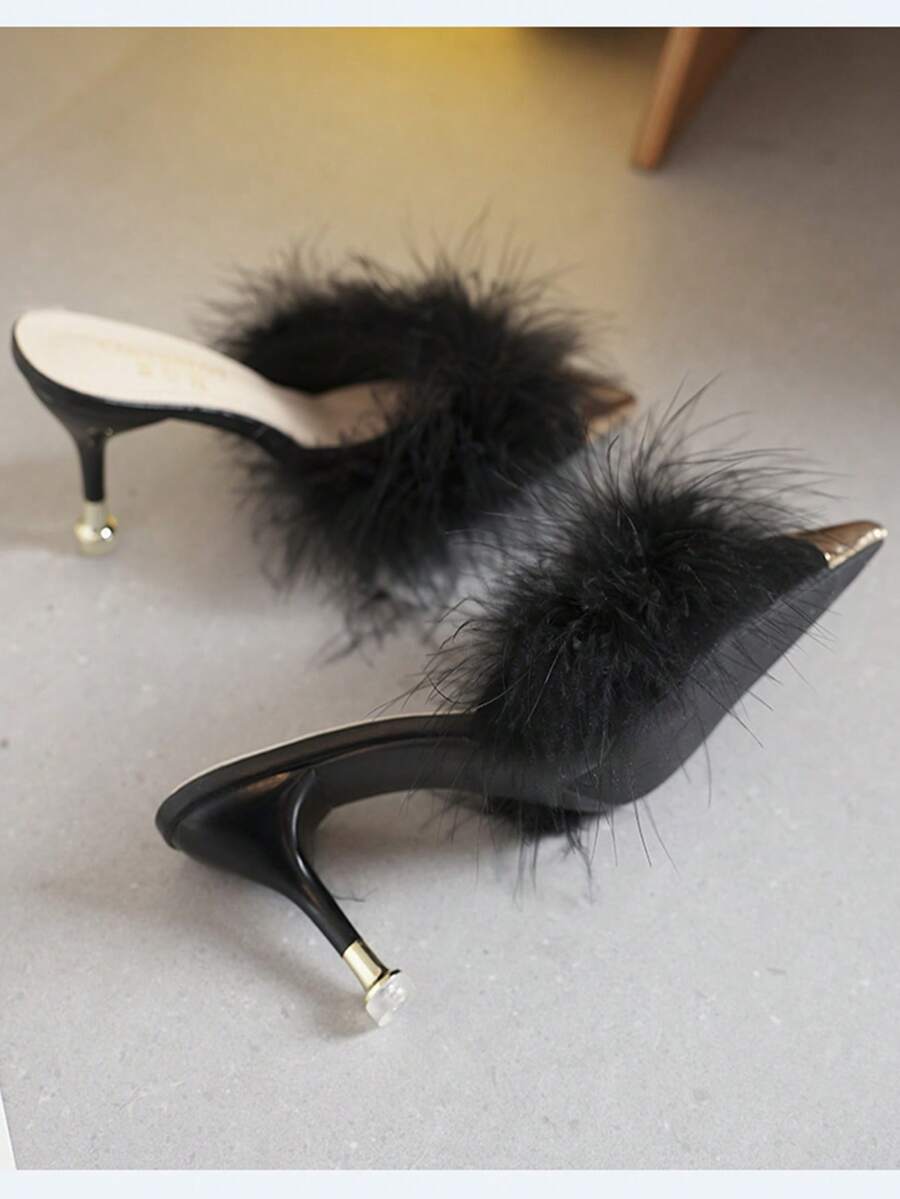 Burgundy pointed toe stiletto heel mules featuring fuzzy faux fur trim and a sleek slip-on design.