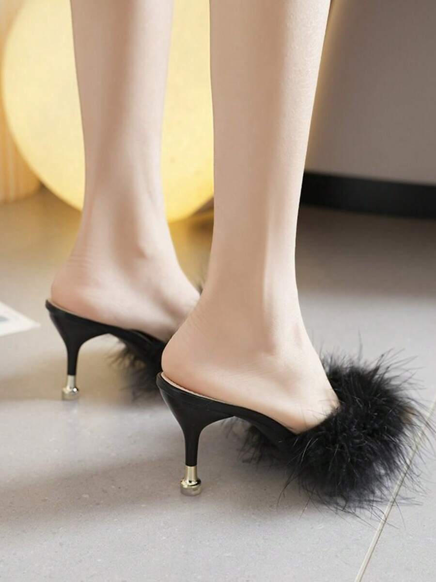 Burgundy pointed toe stiletto heel mules featuring fuzzy faux fur trim and a sleek slip-on design.