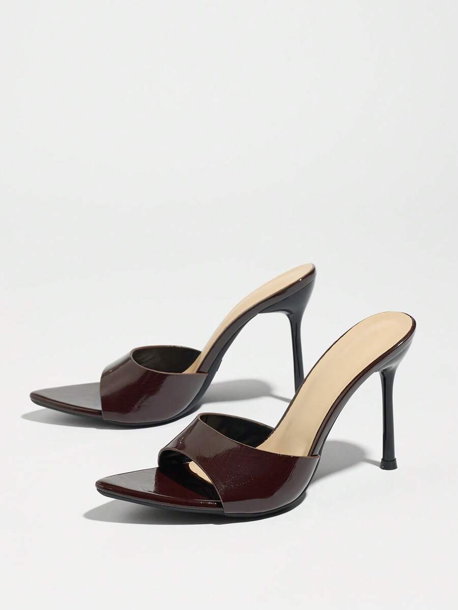 Women's coffee brown high heel mule shoes featuring a glossy mirror finish, open toe design, and sleek stiletto heel.