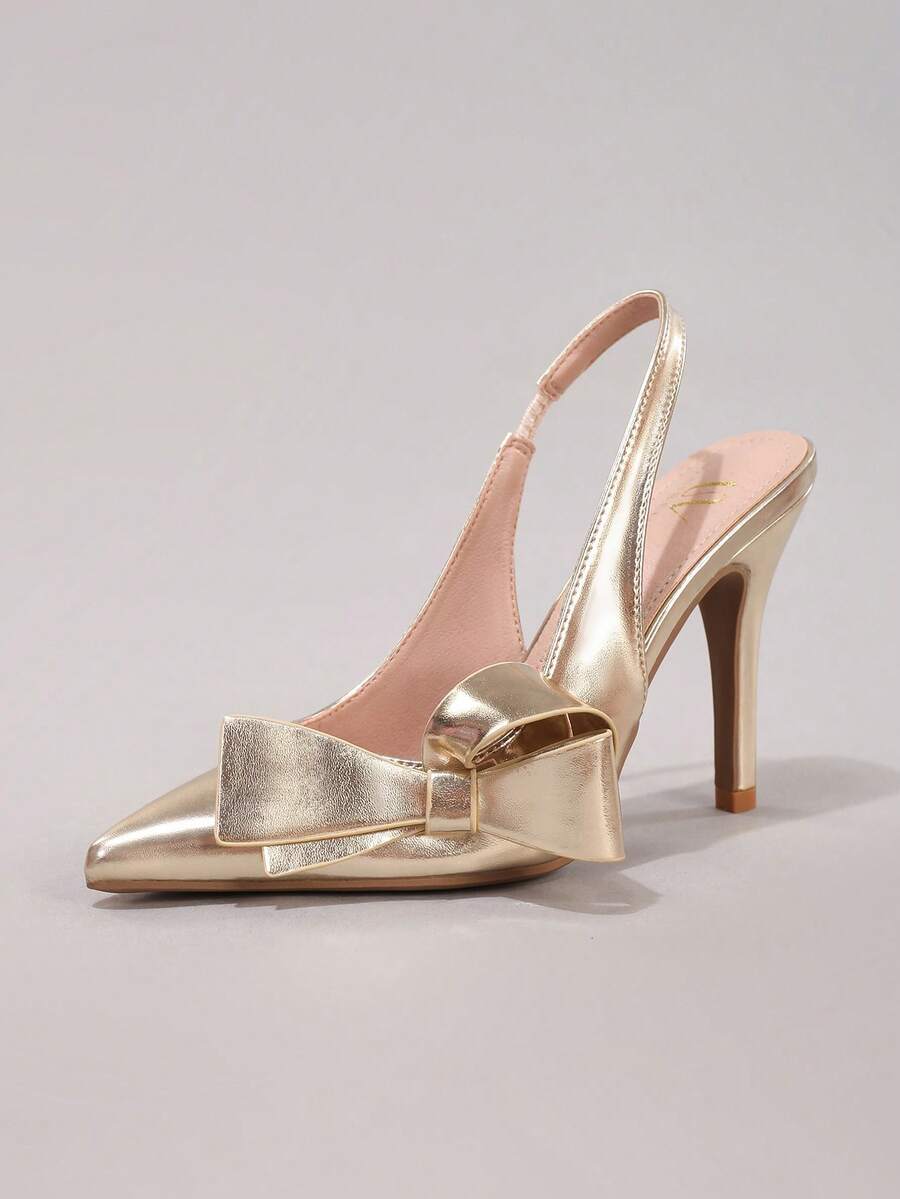 Black lace pointed toe high heel pumps featuring stiletto heels and a decorative bow accent.