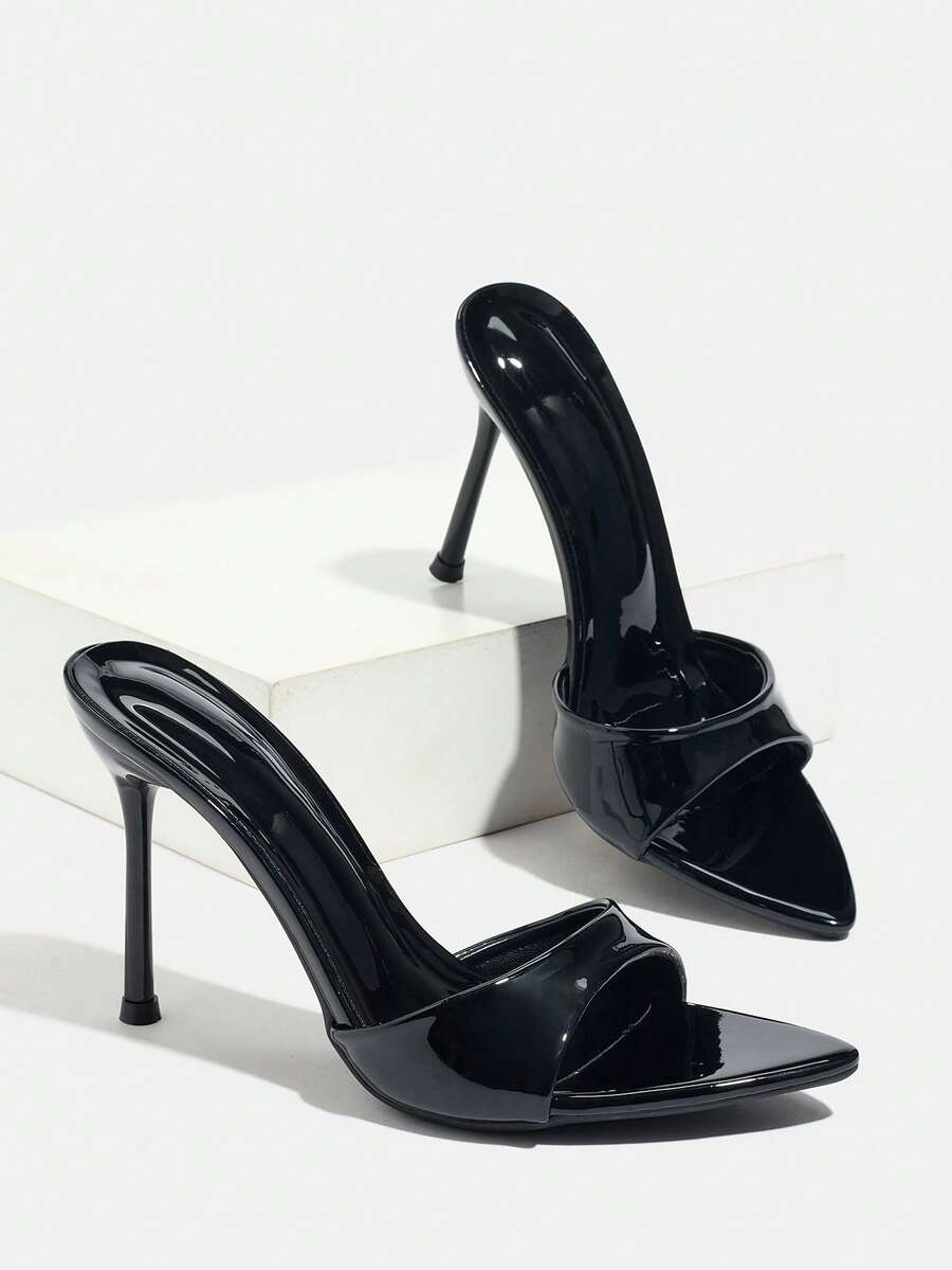 Women's elegant open toe high heel party mules featuring sleek stiletto heels and a slip-on design.