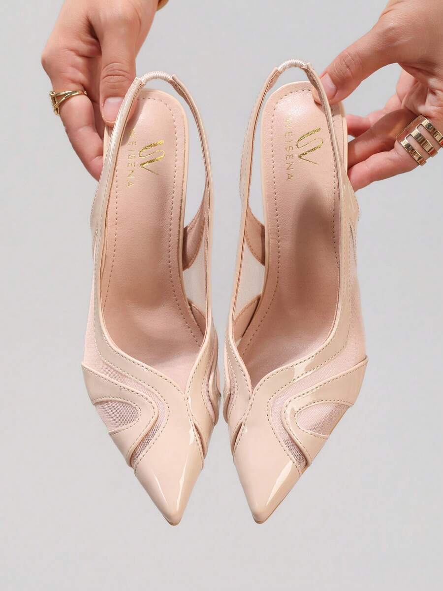Black lace pointed toe high heel pumps featuring stiletto heels and a decorative bow accent.
