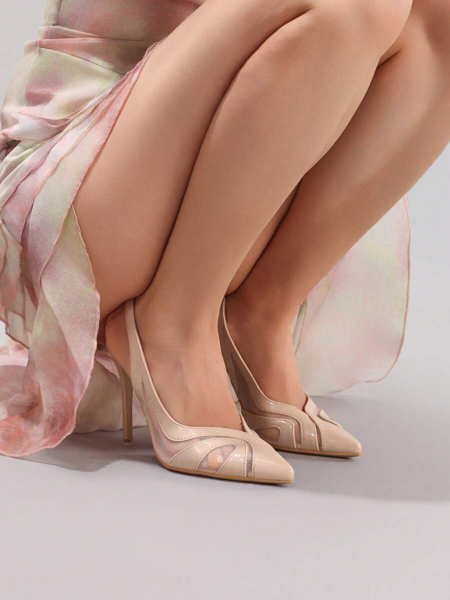 Black lace pointed toe high heel pumps featuring stiletto heels and a decorative bow accent.
