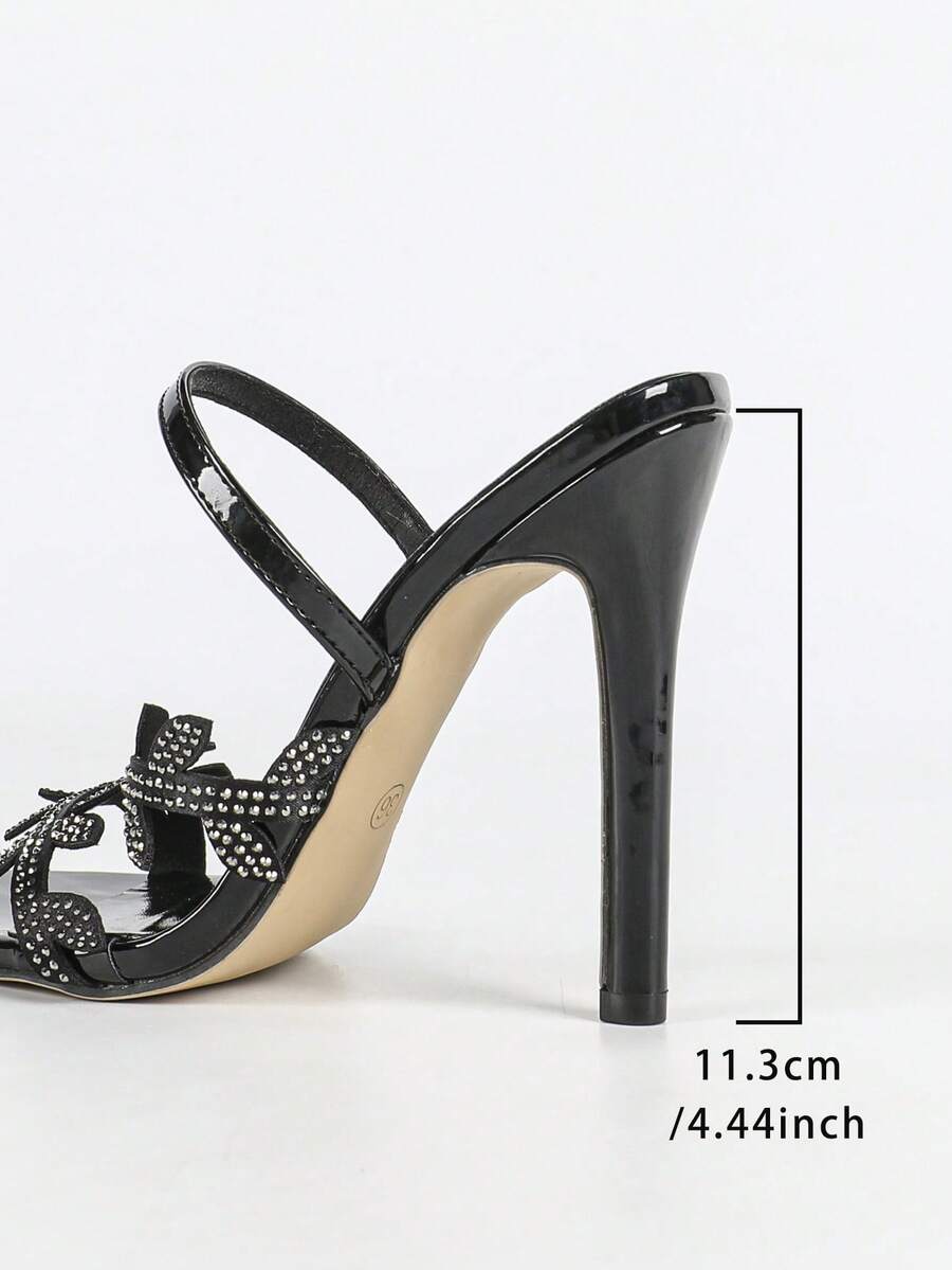 Women's stiletto high heel sandals with sparkling vine-shaped rhinestone ankle strap embellishments and open pointed toe design.