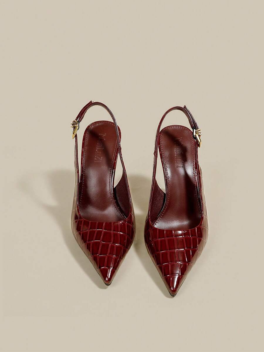 Women's pointed toe kitten heel pumps with adjustable buckle back strap and sleek patent finish.