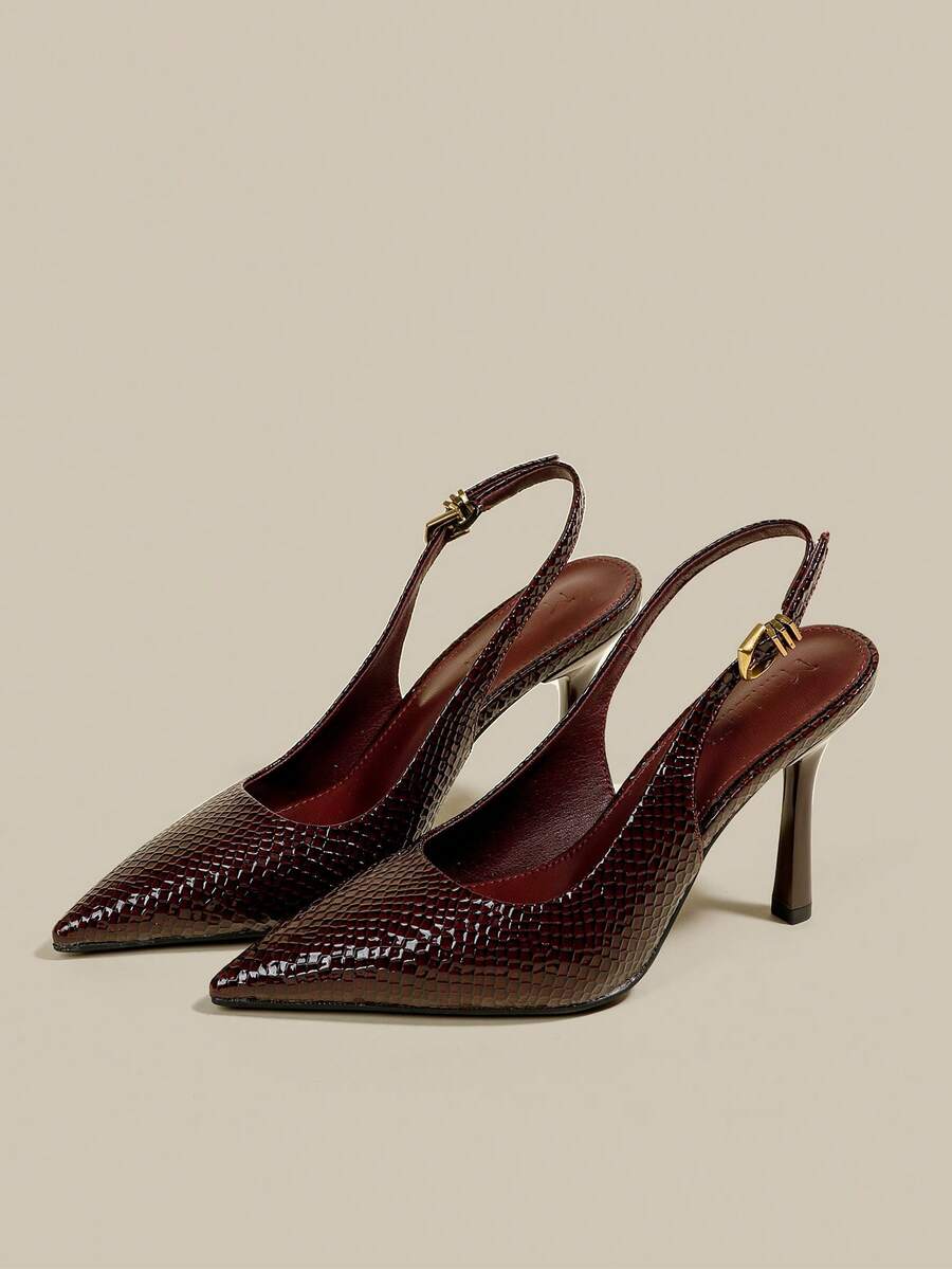 Women's pointed toe kitten heel pumps with adjustable buckle back strap and sleek patent finish.