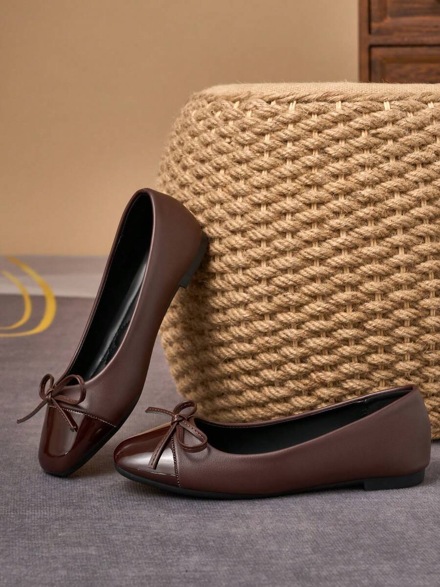 Pair of women's square toe slip-on flat shoes featuring a delicate bow detail and low vamp design.