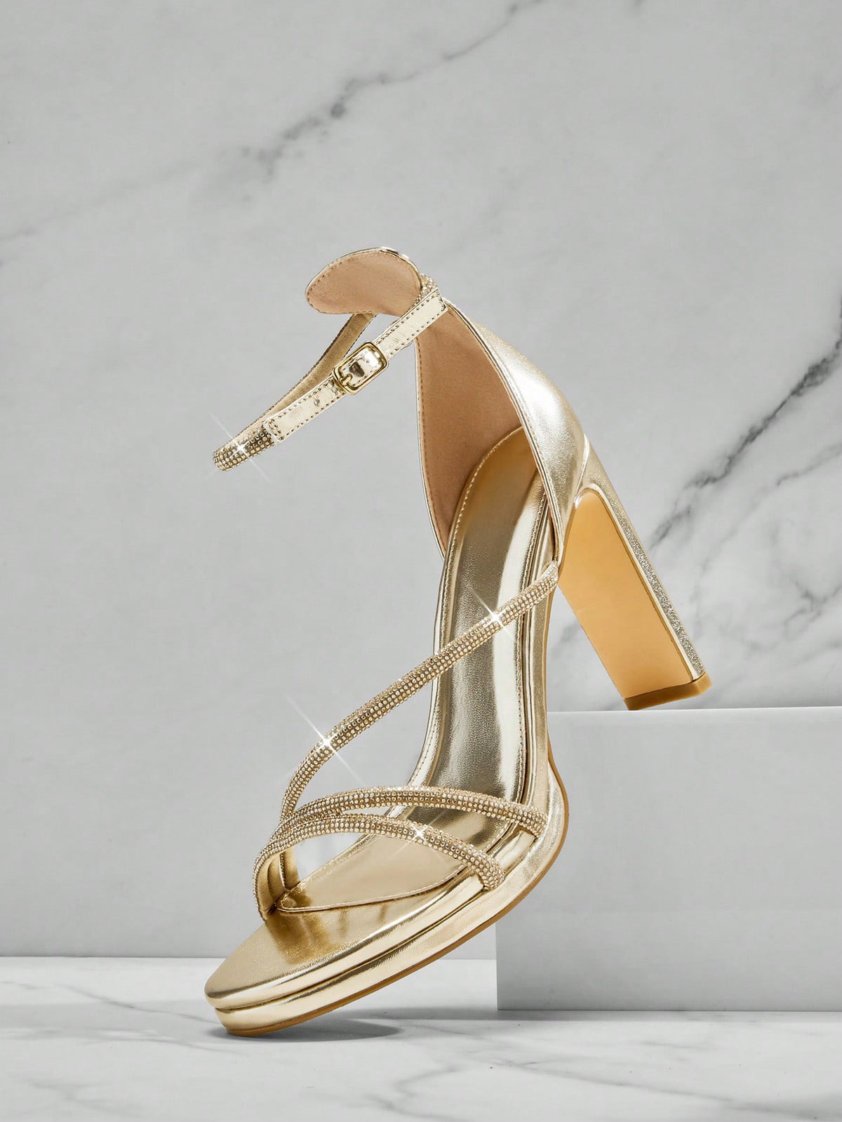 Open square toe high heel sandals with sparkling rhinestone straps, an adjustable ankle buckle closure, and a sleek stiletto heel.