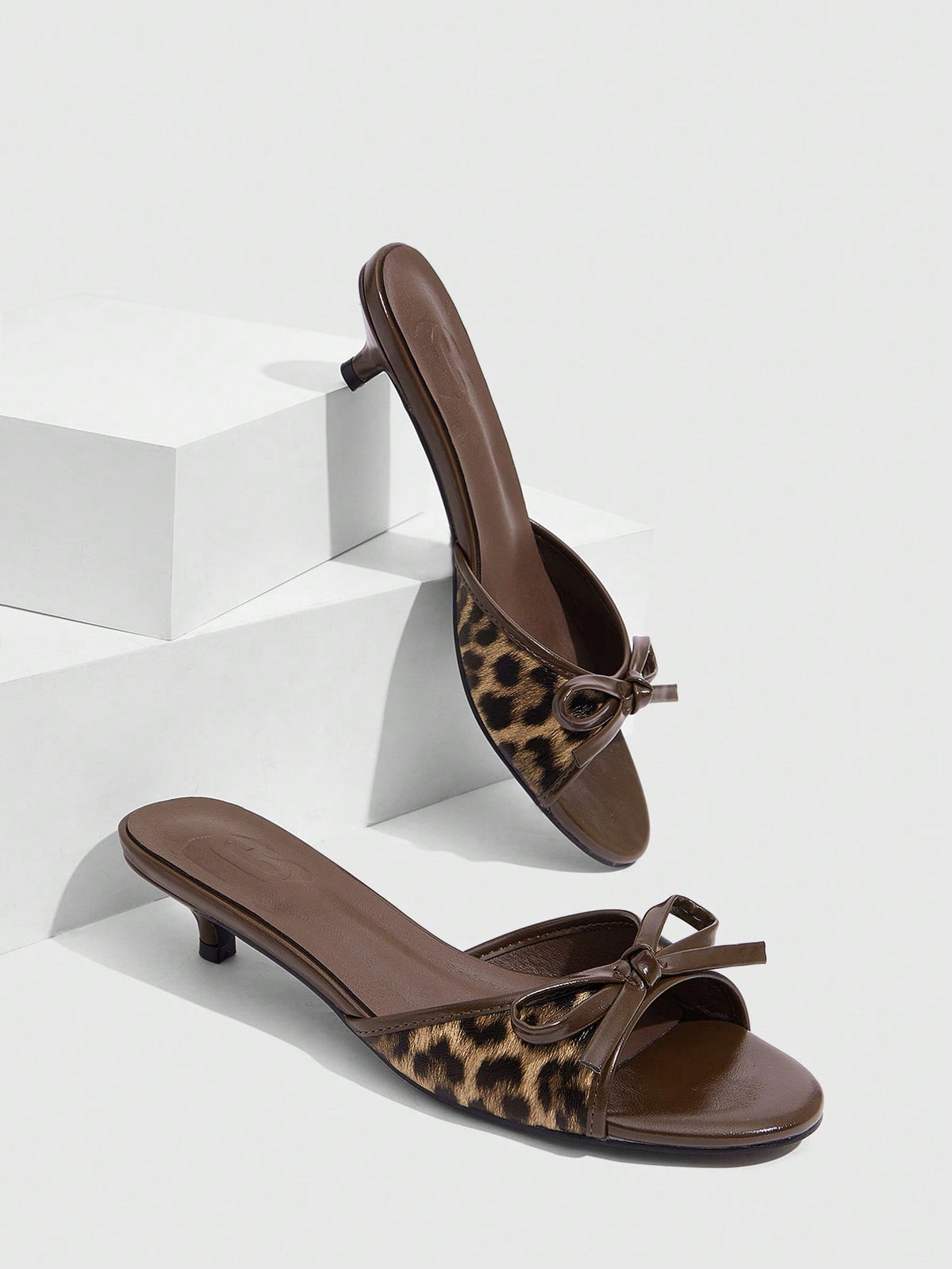 Burgundy high heel sandals for women featuring an open toe, decorative bow, 5.5cm kitten heel, and slingback strap.