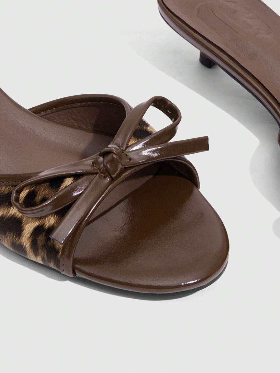 Burgundy high heel sandals for women featuring an open toe, decorative bow, 5.5cm kitten heel, and slingback strap.