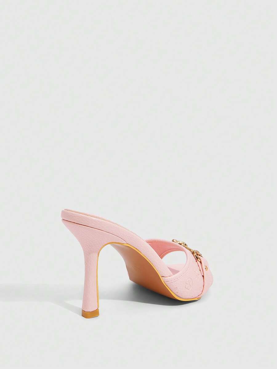 Women's open toe high heel slingback sandals featuring metal bamboo joint accent and stiletto heels.