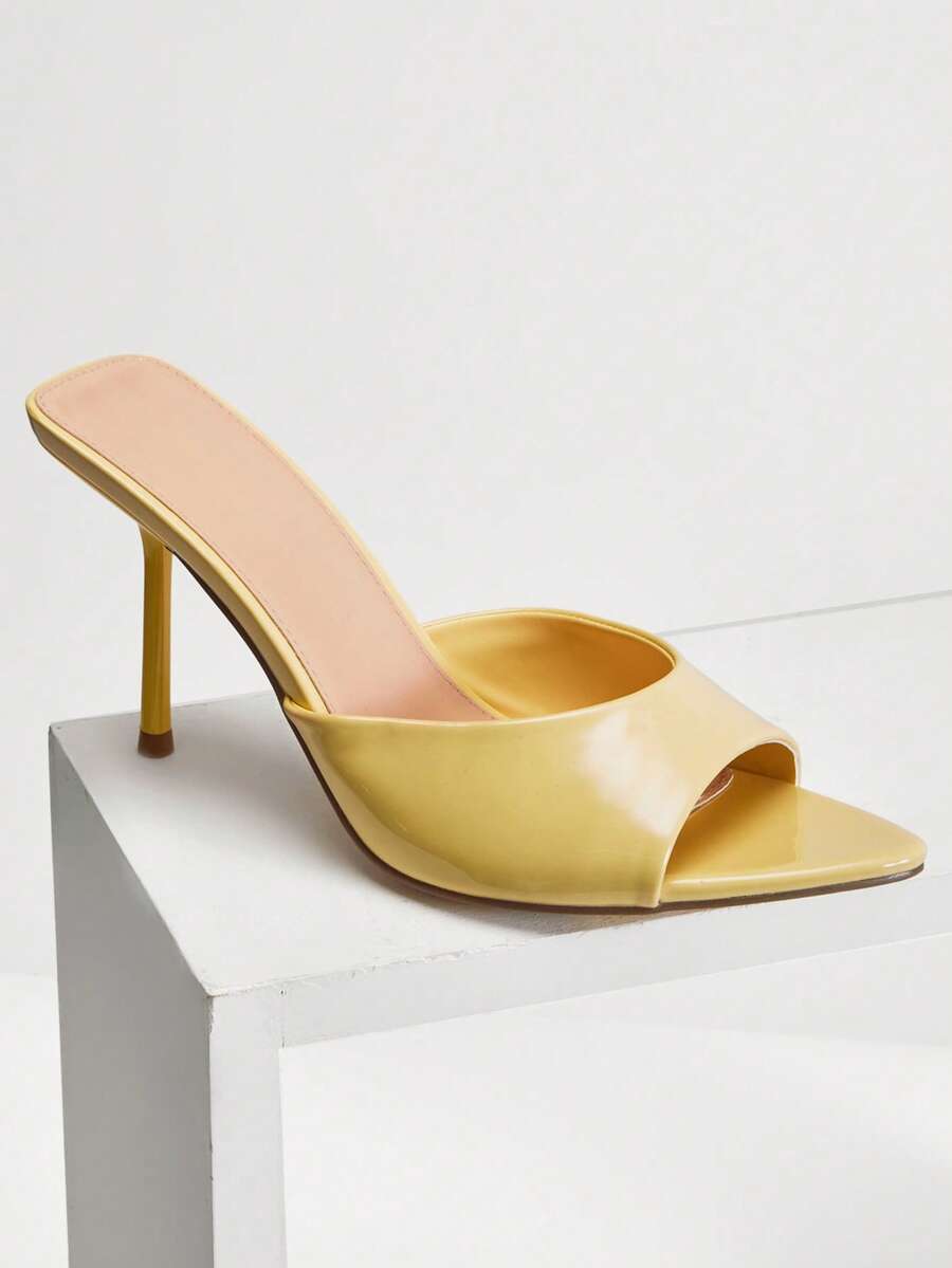 Women's pointed toe stiletto high heel wedding shoes featuring an elegant silhouette and glossy finish.
