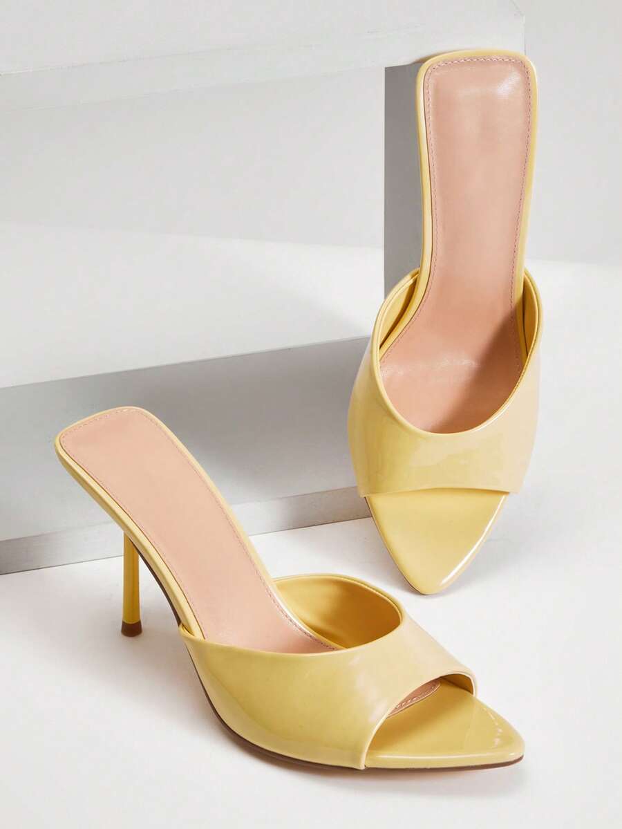 Women's pointed toe stiletto high heel wedding shoes featuring an elegant silhouette and glossy finish.