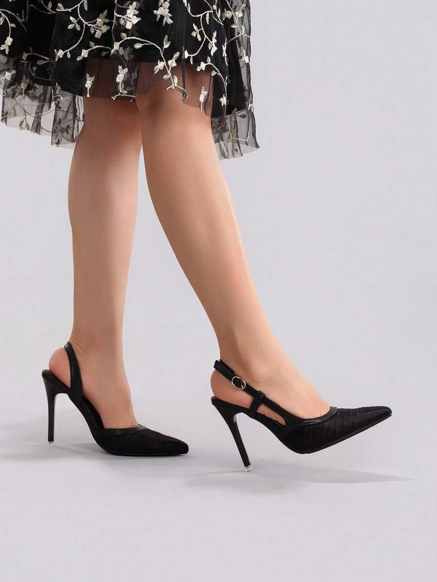 Black lace pointed toe high heel pumps featuring stiletto heels and a decorative bow accent.
